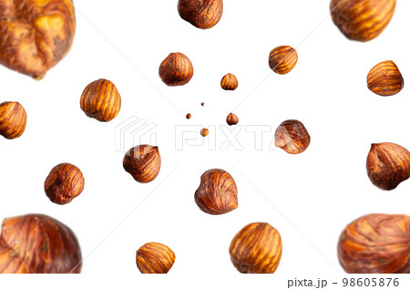 Collection of tasty crispy Hazelnut falling isolated on white background. Selective focus Collection of tasty crispy Hazelnut falling isolated on white background. Selective focus 98605876