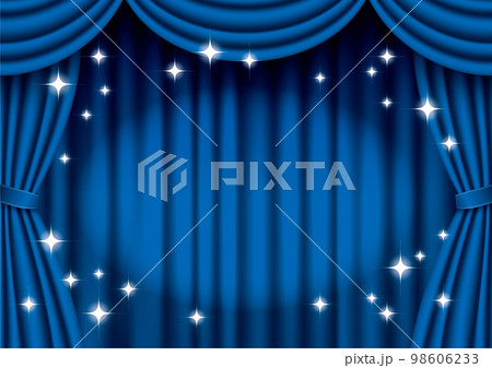 スポットライトが当たっているキラキラしている青色の緞帳 98606233