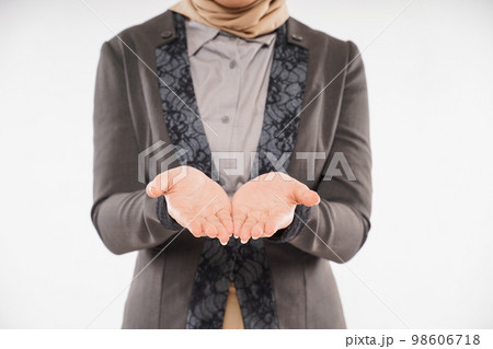 a beautiful woman with hijab standing with hands opened a beautiful woman with hijab standing with hands opened 98606718