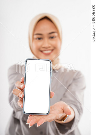 a beautiful woman with hijab standing and showing the phone a beautiful woman with hijab standing and showing the phone 98606830
