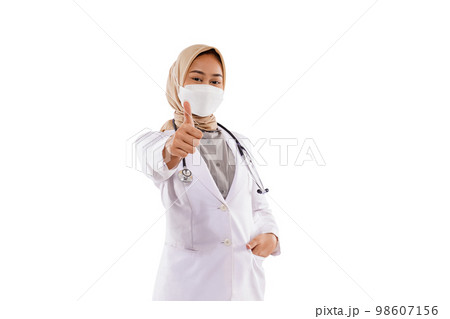a beautiful doctor with hijab standing with thumb up 98607156