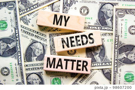 My needs matter symbol. Concept words My needs matter on wooden blocks. Dollar bills. Beautiful background from dollar bills. Business, psychological and my needs matter concept. Copy space. 98607200