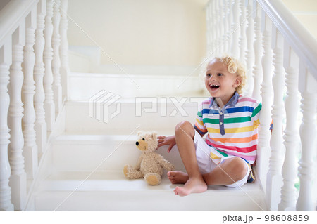 Kids on stairs. Child moving into new home. Kids on stairs. Child moving into new home. 98608859