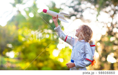 Little boy playing with spaceship. Astronaut kid. Little boy playing with spaceship. Astronaut kid. 98608860