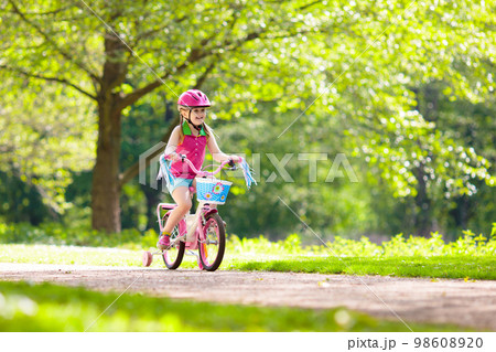 Child riding bike. Kid on bicycle. Child riding bike. Kid on bicycle. 98608920