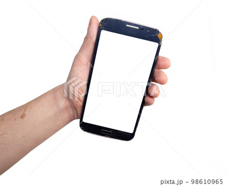 Mockup. Phone in the hand of a man. Blank white space on the phone screen.  The smartphone is broken. 98610965