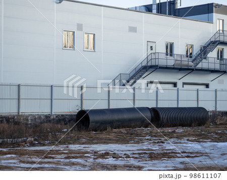 Huge pipes in the industrial area. Abandoned pipes. Huge pipes in the industrial area. Abandoned pipes. 98611107