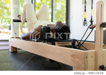 Activ middle-aged African-American man during pulling stretch band Activ middle-aged African-American man during pulling stretch band 98611628