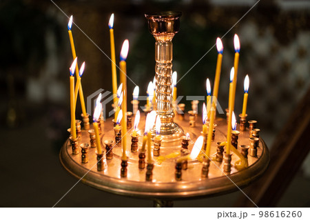 many candles in the church 98616260