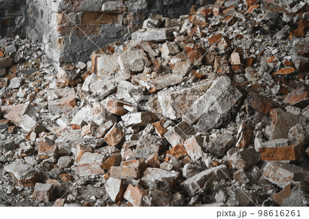 old broken red brick, destroyed wall of the building 98616261