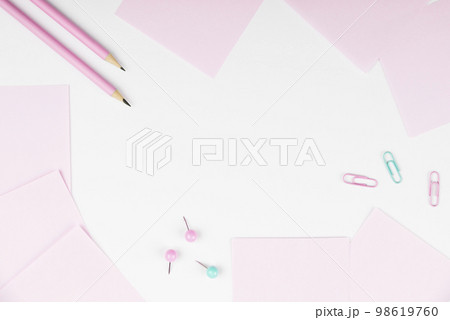 Notebook and Colored Papers Stickers Lying On White Desk. Multiple Assorted Collection Office Stationery. Photo With Pens Pencils Rullers Calculators. 98619760
