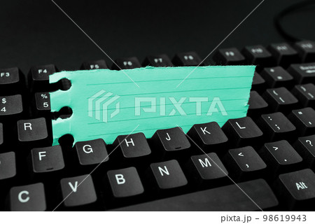 Colored sticker lying on black keyboard. Important information written over paper. Image with school supplies. Multiple Assorted Collection Office Stationery. Colored sticker lying on black keyboard. Important information written over paper. Image with school supplies. Multiple Assorted Collection Office Stationery. 98619943