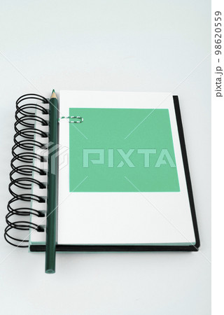 Multiple Assorted Collection Office Stationery Photo With Pens Pencils Notepads Notebook Ruler Stapler Scissors Clippers Paper Clips Holders Clipboard Placed Over Table. 98620559