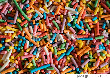 Festive texture background multicolored sweet sprinkles. 98621087