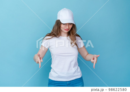 Shopping concept. Surprised cute caucasian girl checking discounts, pointing Shopping concept. Surprised cute caucasian girl checking discounts, pointing 98622580
