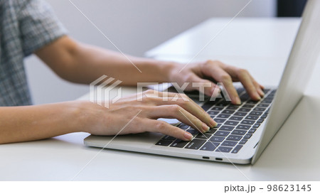 Woman hand using laptop or computor searching for information in internet online society web.  98623145