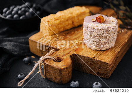 Kiev cake with Hazelnut and chocolate on board Kiev cake with Hazelnut and chocolate on board 98624010