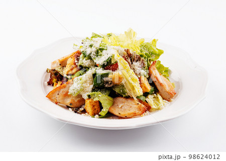 Traditional classic Caesar salad in white plate Traditional classic Caesar salad in white plate 98624012