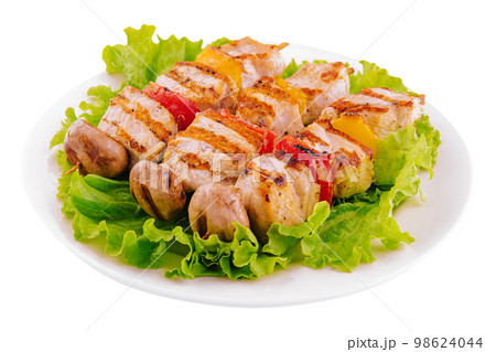 pork skewers with grilled bell peppers and mushrooms 98624044
