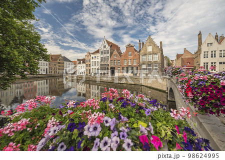 Bruges Belgium, city skyline at Spiegelrei Canal with summer flower Bruges Belgium, city skyline at Spiegelrei Canal with summer flower 98624995