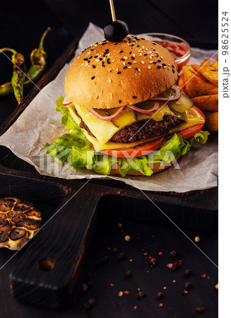 Fresh juicy burger on a cutting board 98625524