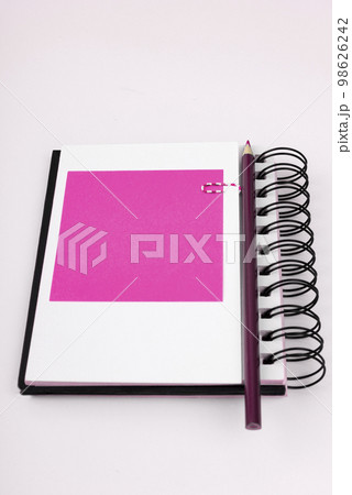 Notebook and Colored Papers Stickers Lying On White Desk. Multiple Assorted Collection Office Stationery. Photo With Pens Pencils Rullers Calculators. Notebook and Colored Papers Stickers Lying On White Desk. Multiple Assorted Collection Office Stationery. Photo With Pens Pencils Rullers Calculators. 98626242