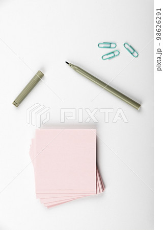 Notebook and Colored Papers Stickers Lying On White Desk. Multiple Assorted Collection Office Stationery. Photo With Pens Pencils Rullers Calculators. Notebook and Colored Papers Stickers Lying On White Desk. Multiple Assorted Collection Office Stationery. Photo With Pens Pencils Rullers Calculators. 98626291