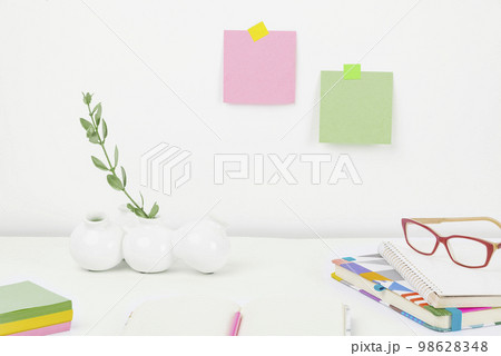 Office Supplies Over Desk With Keyboard And Glasses And Coffee Cup For Working Remotely, Assorted School Utilities For Studying With Hot Drink And Eyeglasses. 98628348