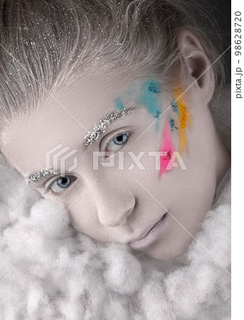portrait of a beautiful girl with frozen makeup of Snow Queen, with ice and snow portrait of a beautiful girl with frozen makeup of Snow Queen, with ice and snow 98628720