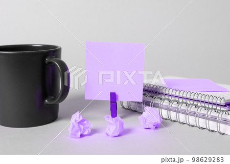 Coffee Cup Standing on Desk. Important infrormation written on paper. Different Office Supplies, Pencils, Pens, Marckers. Computer keyboard. Text on wood table. Coffee Cup Standing on Desk. Important infrormation written on paper. Different Office Supplies, Pencils, Pens, Marckers. Computer keyboard. Text on wood table. 98629283