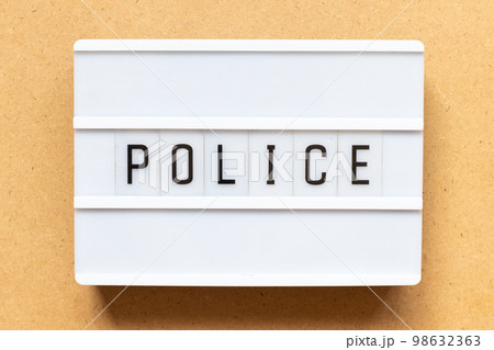 Lightbox with word police on wood background 98632363