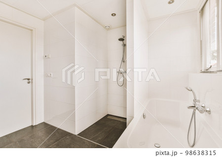 Luxury interior design of a bathroom with marble walls 98638315
