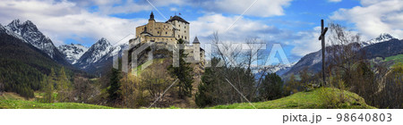 Switzerland travel and landmraks. Impressive  mountain scenery with amazing medieval castle Tarasp surrounded by  Swiss Alps, Canton Grisons or Graubuendon 98640803