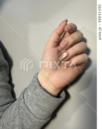 Amazing natural nails. Women's hands with clean manicure 98641490
