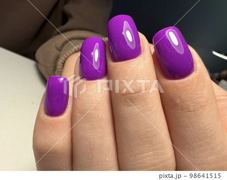 Trendy manicure design on a beautiful background. Trendy manicure design on a beautiful background. 98641515