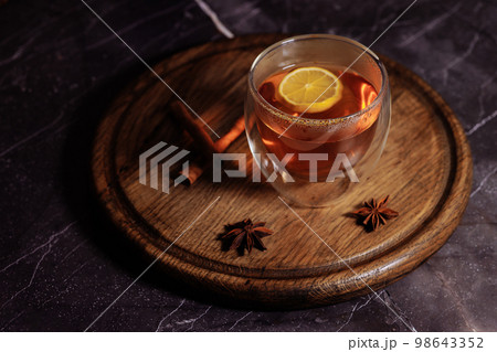 Glass cup of hot tea 98643352