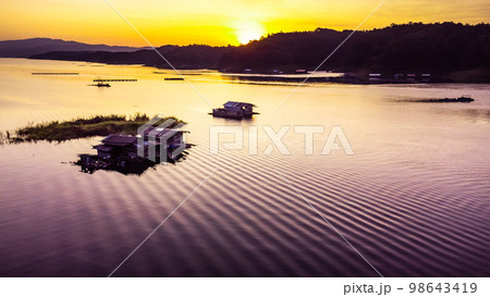 Aerial view of landscape sunset with Reservoir and raft house Thailand 98643419