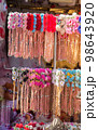 colorful crowns for sale made of fake flowers 98643920