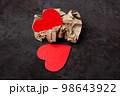 Two red heart icons in wrinkled paper. Valentine love concept 98643922