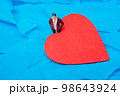 Man figurine beside heart shape. Valentine concept and promise of love. 98643924