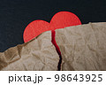 Torn wrinkled paper on heart.  Valentine concept 98643925