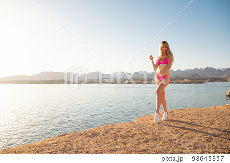 Young woman wearing a swimsuit Young woman wearing a swimsuit 98645357