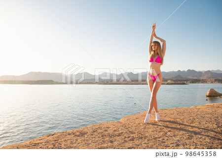 Lovely young woman wearing a swimsuit 98645358