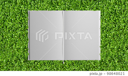 緑が鮮やかなグリーンガーデンと、栞付き白い本の背景 98648021