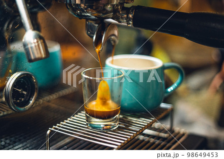 Wonderful espresso shot pouring out Wonderful espresso shot pouring out 98649453