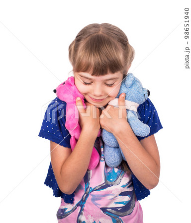Little girl holding a teddy bear. Isolated on white background. Girl hugging two teddybears. Happy child. 98651940
