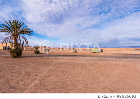 Endless landscape in the desert in Morocco with objects scattered along the ground Endless landscape in the desert in Morocco with objects scattered along the ground 98656692