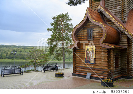 Wooden Christian Orthodox Church with the text of a prayer on a stone tablet in Siberia, Russia Wooden Christian Orthodox Church with the text of a prayer on a stone tablet in Siberia, Russia 98657563