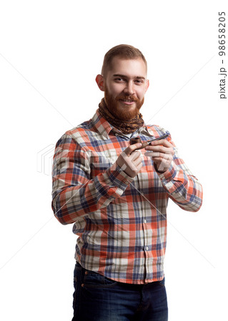 Portrait of handsome bearded redhead man in checked shirt who smoking pipe on white background Portrait of handsome bearded redhead man in checked shirt who smoking pipe on white background 98658205