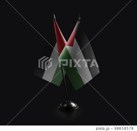 Small national flags of the Palestine on a black background 98658578